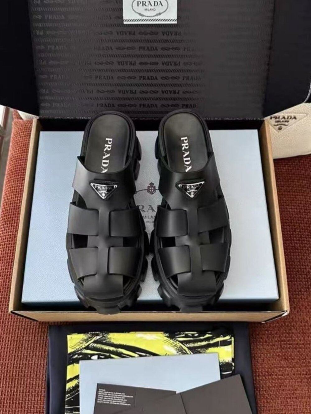 Prada Solid Black Polished Leather Woven Triangle Logo Slides